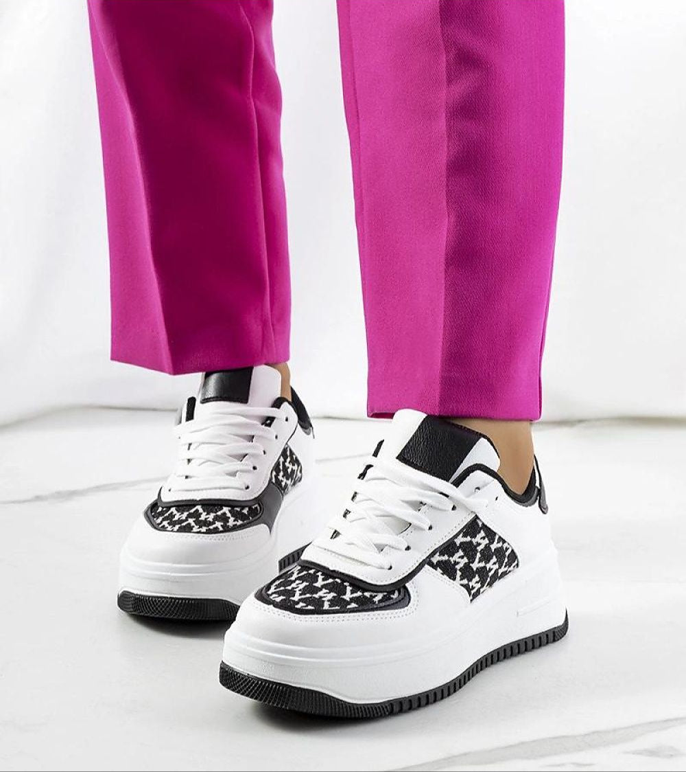 Myrelith Lifted Sole Lace Sneakers with eco leather upper and elevated sole, showcased with vibrant pink pants.