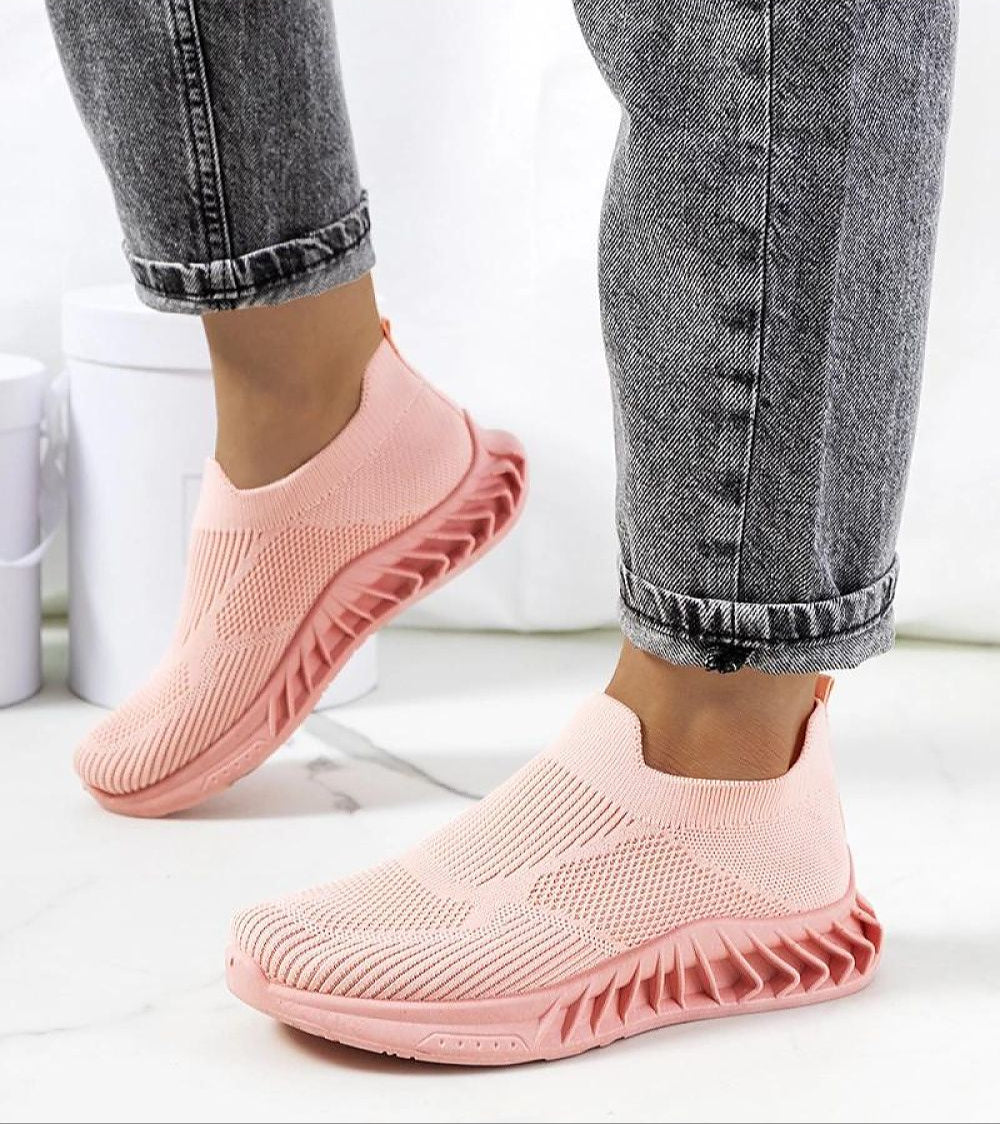 Zavella Slip-On Sport Knit Sneakers in pink, featuring breathable fabric and a flexible silhouette, ideal for summer wear.