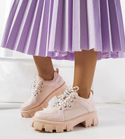 Aurenza Daywalk platform sneakers with eco leather upper and chunky sole in pink, worn with purple skirt for a stylish look.