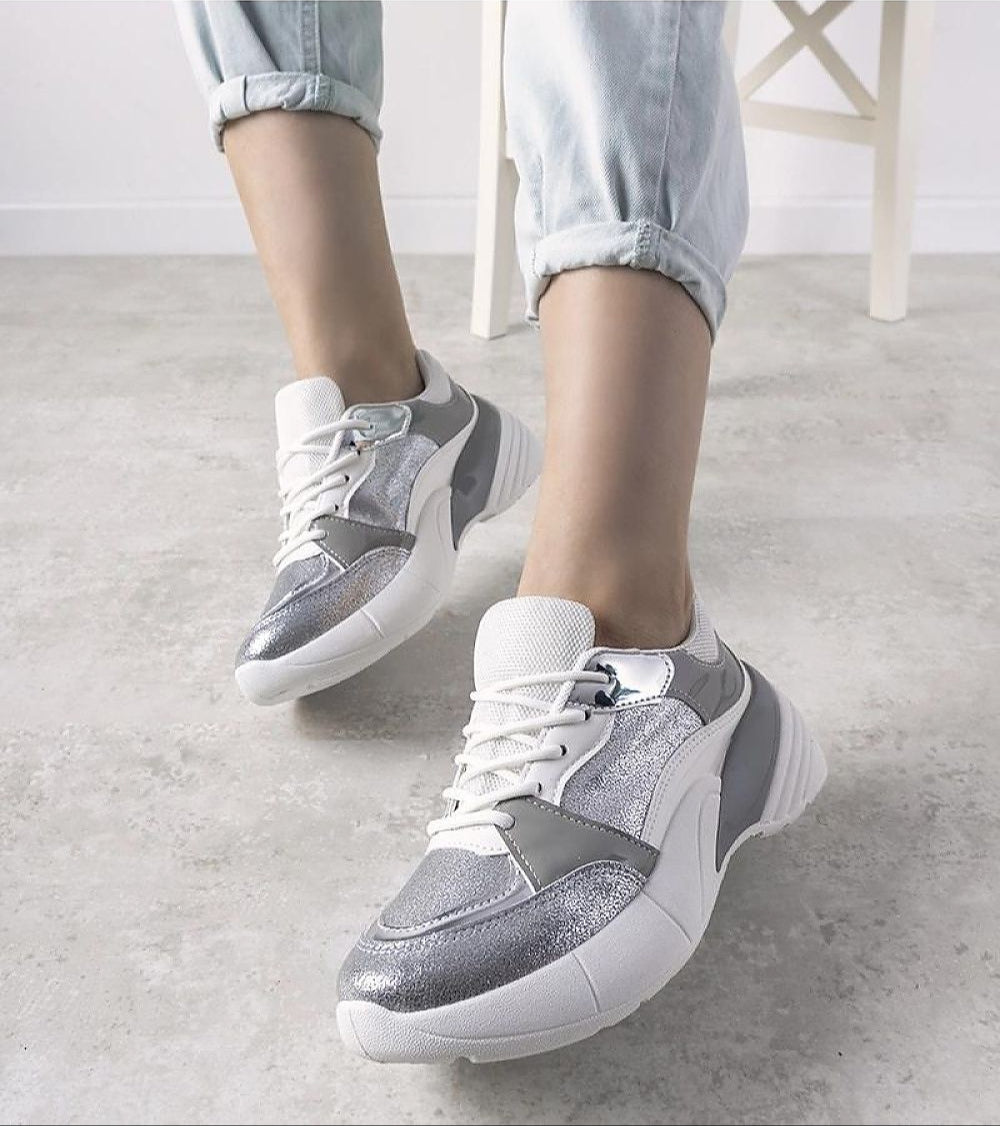 Zelphira Metallic Contrast Platform Sneakers with silver eco leather, high white sole, and lace-up closure on a grey floor.