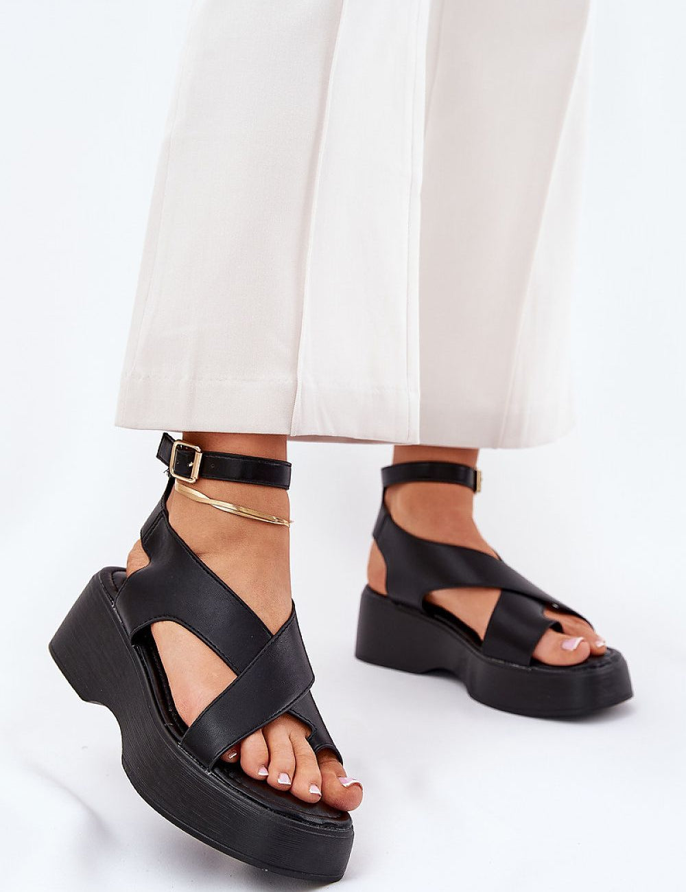 Model wearing Lirianne Platform Buckle Sandals with eco leather, wedge platform, and ankle strap, perfect for warm weather style.