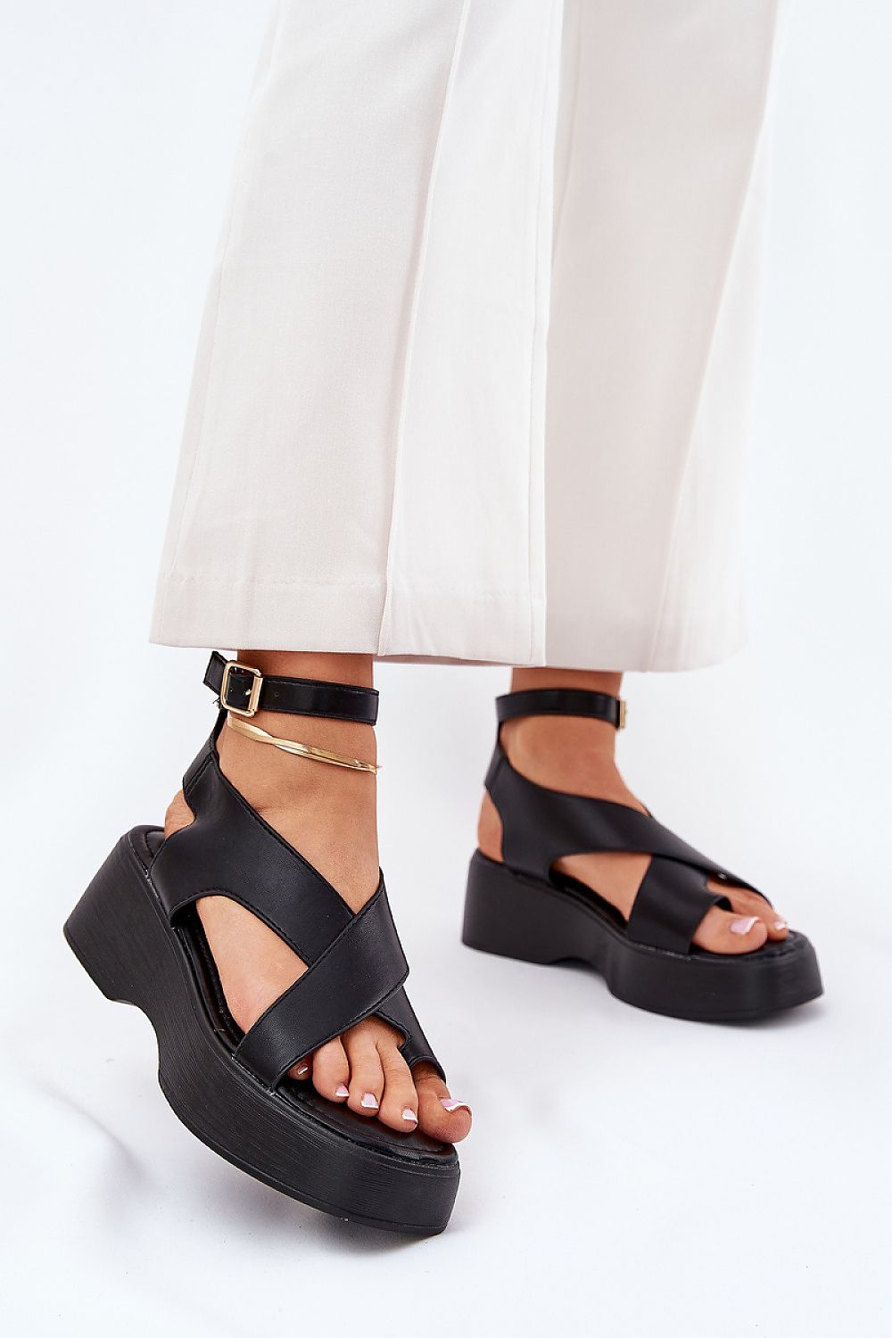 Model wearing Lirianne Platform Buckle Sandals with eco leather, wedge platform, and ankle strap, perfect for warm weather style.