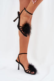 Lavea Feather-Embellished Stilettos with eco suede finish and ankle strap, perfect for elegant evening wear, shown on a model.