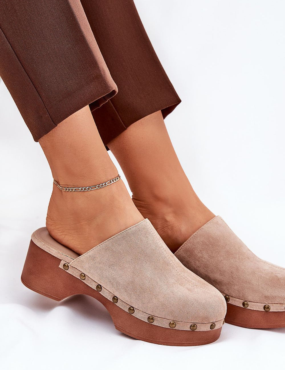 Corveda Studded Suede Wedge Clogs on model, featuring bohemian charm, eco suede, wedge heel, and studded trim for stylish comfort.