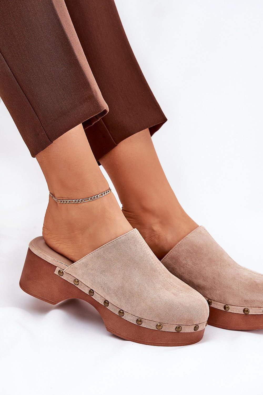 Corveda Studded Suede Wedge Clogs on model, featuring bohemian charm, eco suede, wedge heel, and studded trim for stylish comfort.