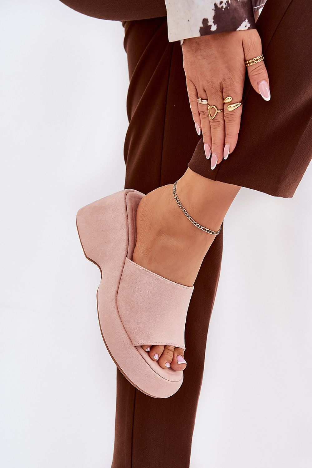 Woman wearing Zalhera Elevated Textile Wedge Sandals with pink suede-like fabric, showcasing open-toe design and cushioned platform.