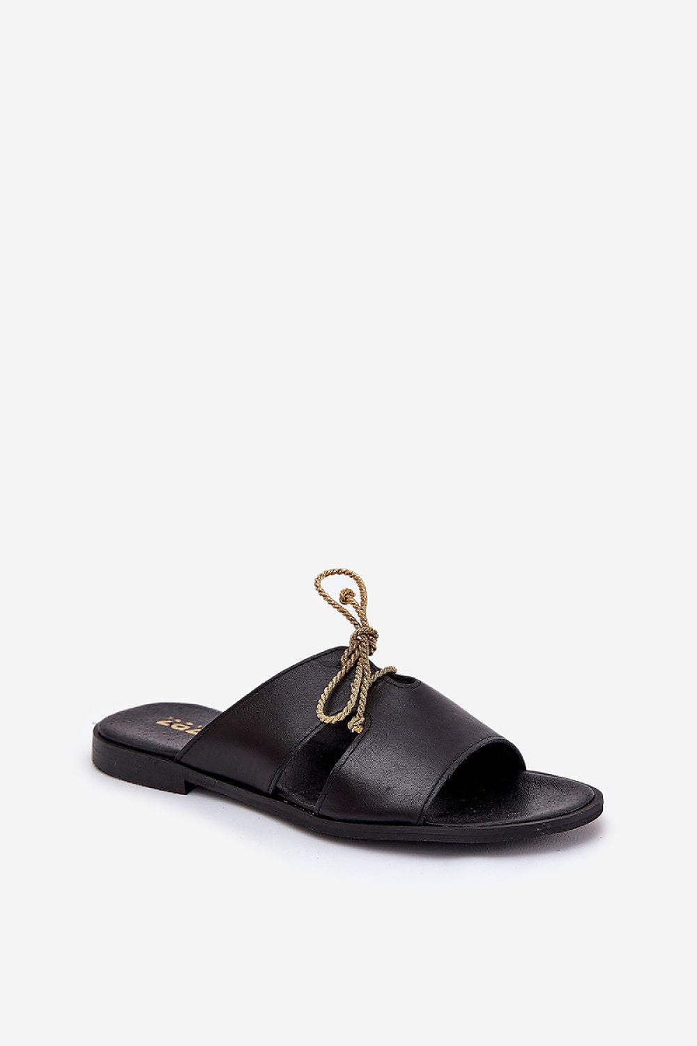 Black leather slide with gold accent and flat heel, featuring a minimalist design and elegant golden string detail on the upper for comfort.