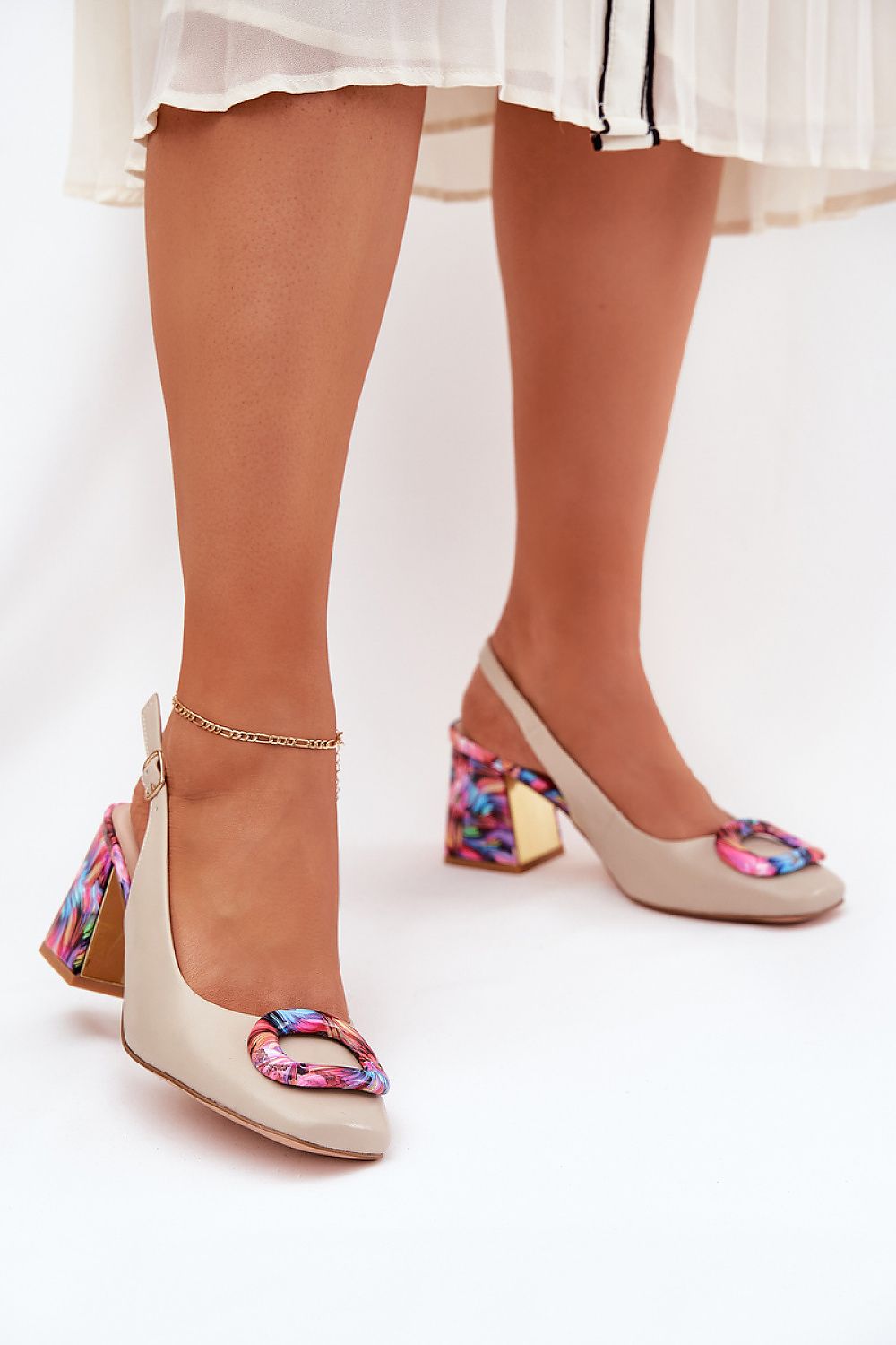 Mariselle Patterned Heel Leather Sandals with embellished heel and front ornament, featuring a closed toe and adjustable ankle strap.