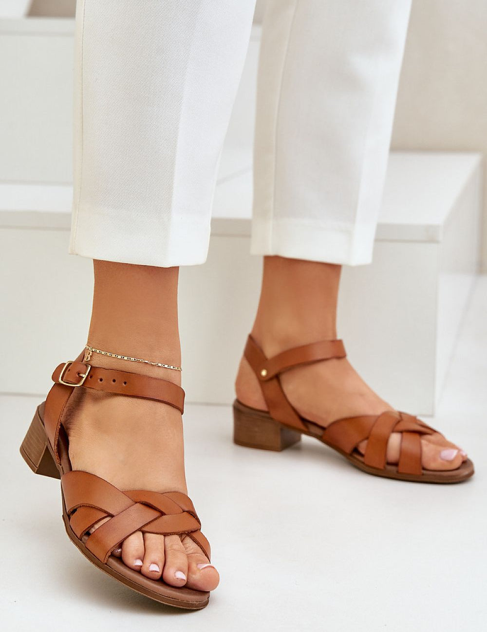 Valerinne cross-strap leather sandals with block heel, featuring refined crossover straps and adjustable ankle closure, perfect for casual wear.
