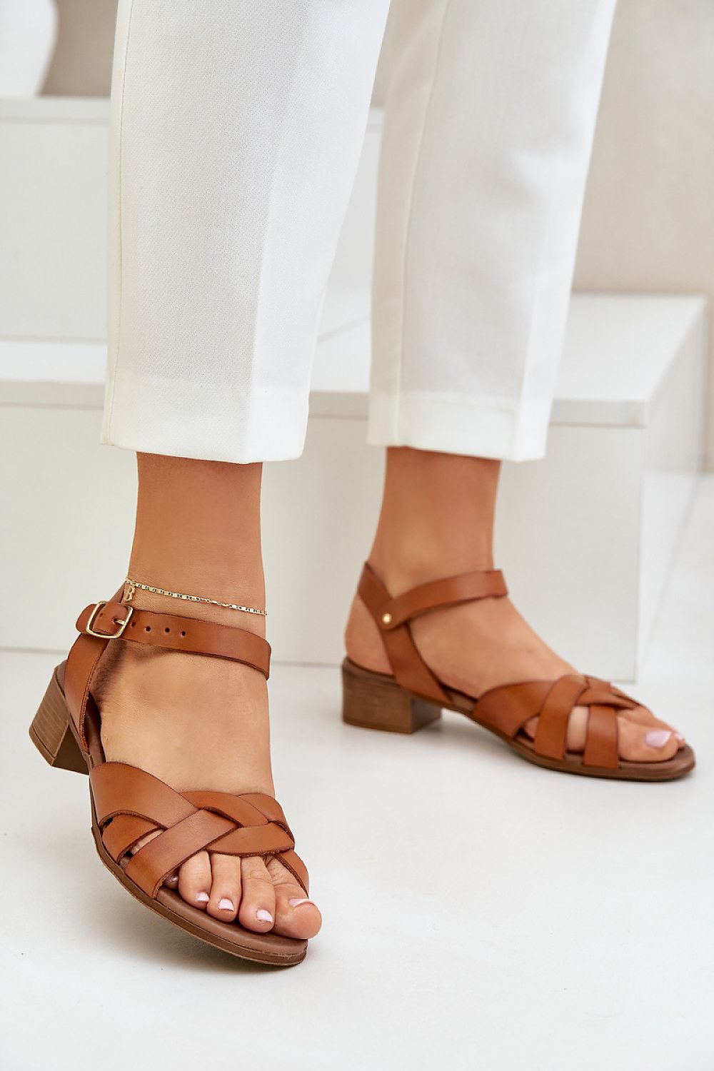Valerinne cross-strap leather sandals with block heel, featuring refined crossover straps and adjustable ankle closure, perfect for casual wear.