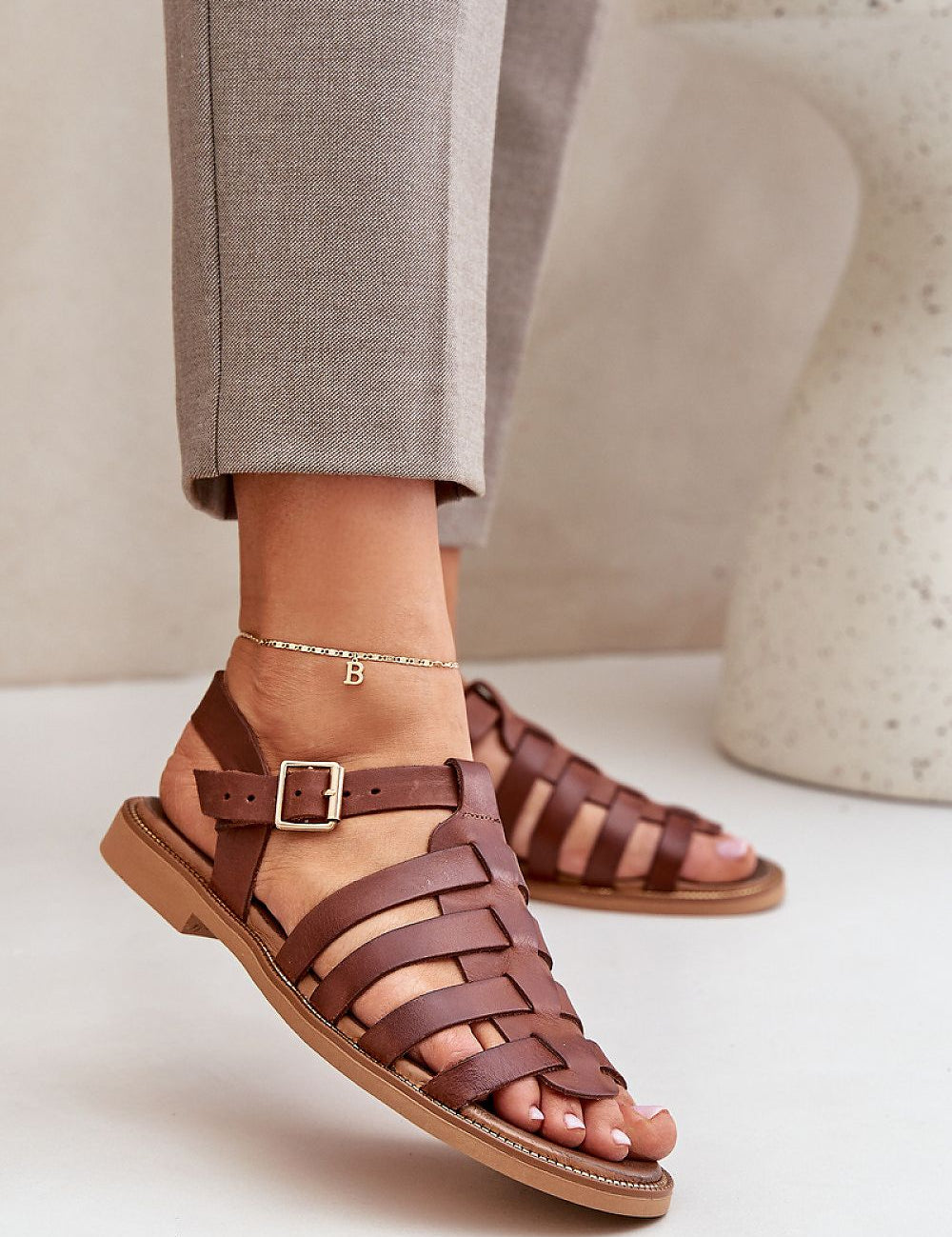 Avelisse Leather Flat Sandals with adjustable buckle and soft insole, shown in brown, perfect for casual and formal wear.