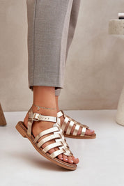 Stylish flat leather sandals with ankle buckle, perfect for casual or formal occasions.