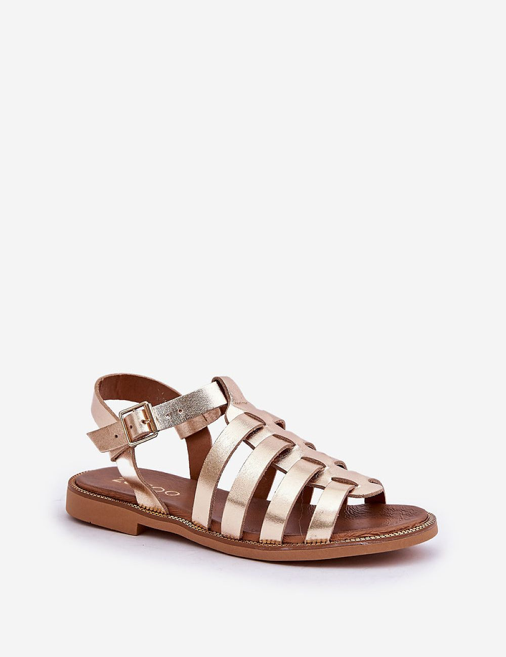 Gold flat leather sandals with a buckled ankle strap, featuring a sleek strappy design for versatile casual or dressy wear.