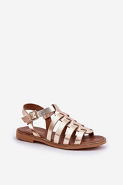 Gold flat leather sandals with a buckled ankle strap, featuring a sleek strappy design for versatile casual or dressy wear.