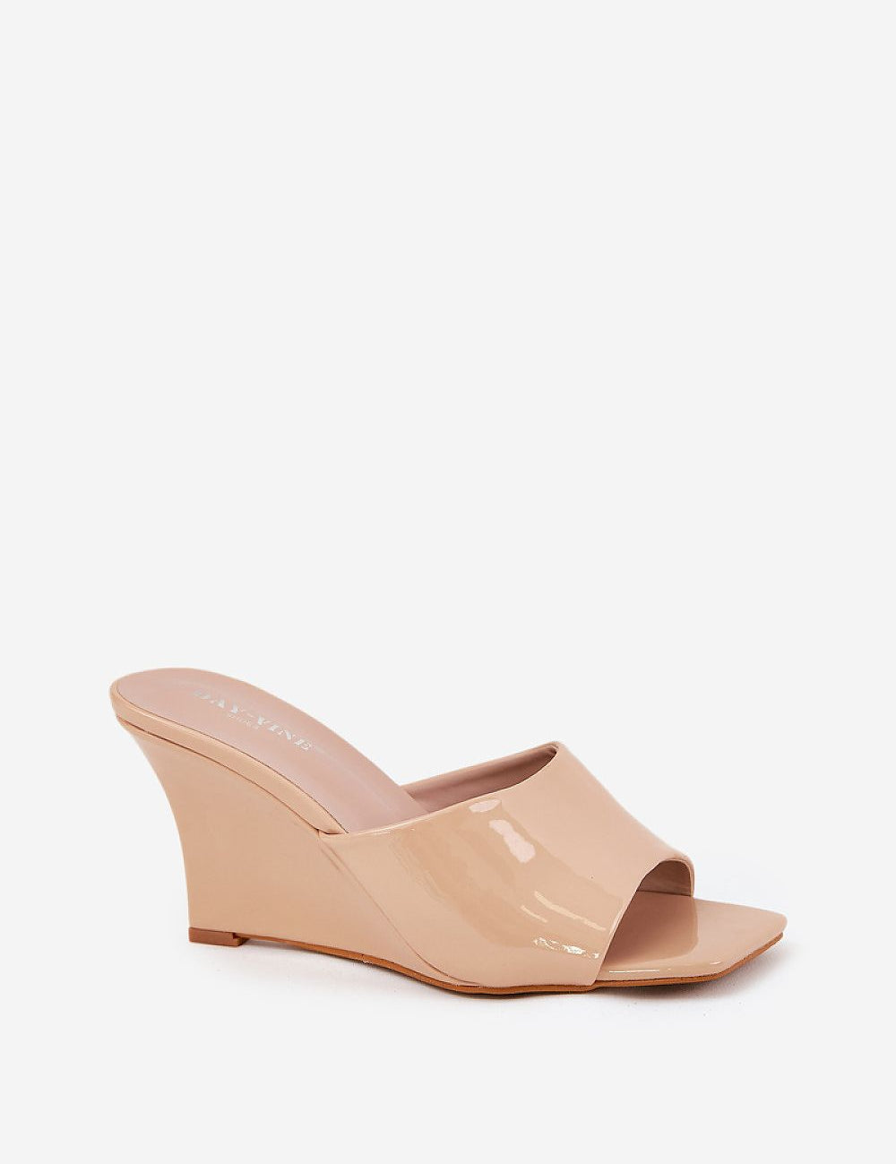 Solena Slip-On Summer Clogs in nude eco leather with wedge heel, perfect for pairing with summer outfits. Open-toe, lightweight design.