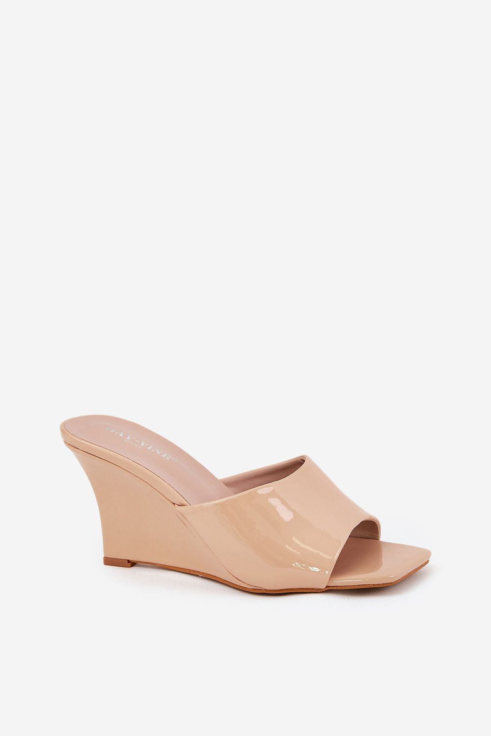 Solena Slip-On Summer Clogs in nude eco leather with wedge heel, perfect for pairing with summer outfits. Open-toe, lightweight design.