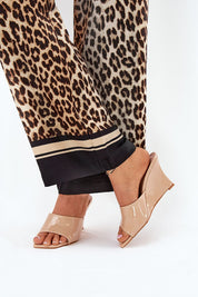 Beige Solena Slip-On Summer Clogs with eco leather wedge, paired with leopard print pants.