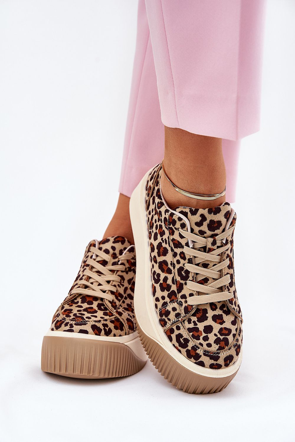 Elessira Platform Street Sneakers in leopard print with chunky soles, paired with pink pants for a stylish urban look.