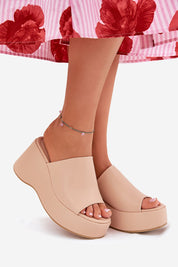 Selentia faux leather wedge sandals with open-toe design, 9 cm heel, and 4 cm platform, styled with floral skirt, ideal for summer.