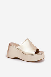 Selentia faux leather wedge sandals with open-toe design and wide platform, featuring sleek gold finish. Perfect for stylish comfort.