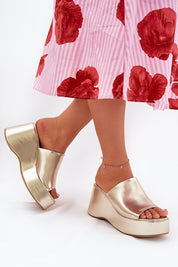 Elegant faux leather wedge sandals with a sleek platform and open-toe design, perfect for summer fashion.