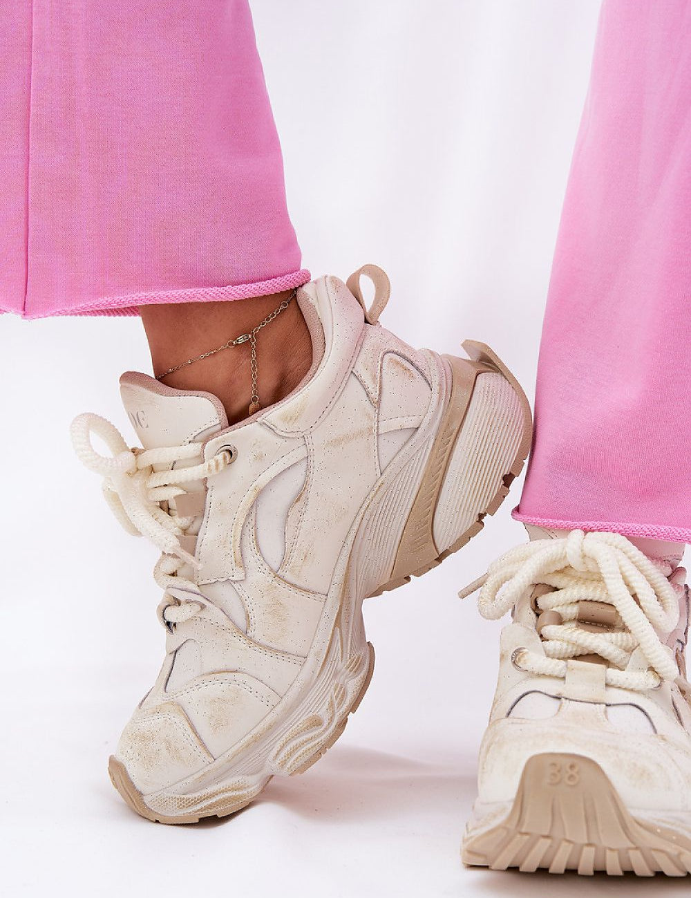 Avrielle sequin lace-up sport shoes with platform sole and natural leather upper, shown with pink leggings.