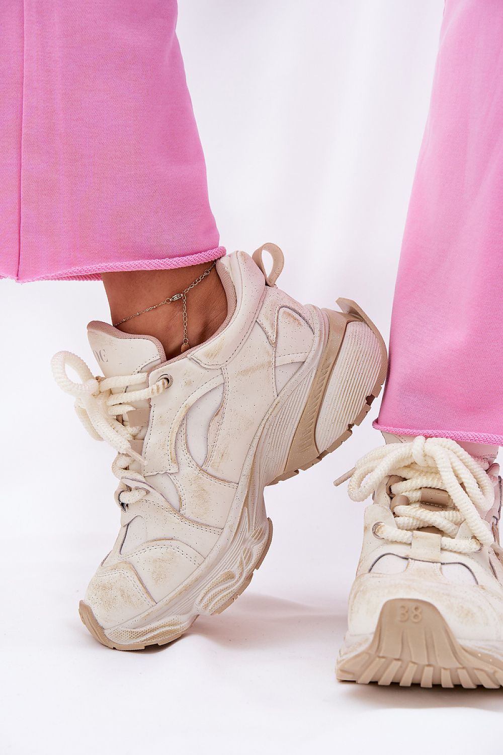 Avrielle sequin lace-up sport shoes with platform sole and natural leather upper, shown with pink leggings.