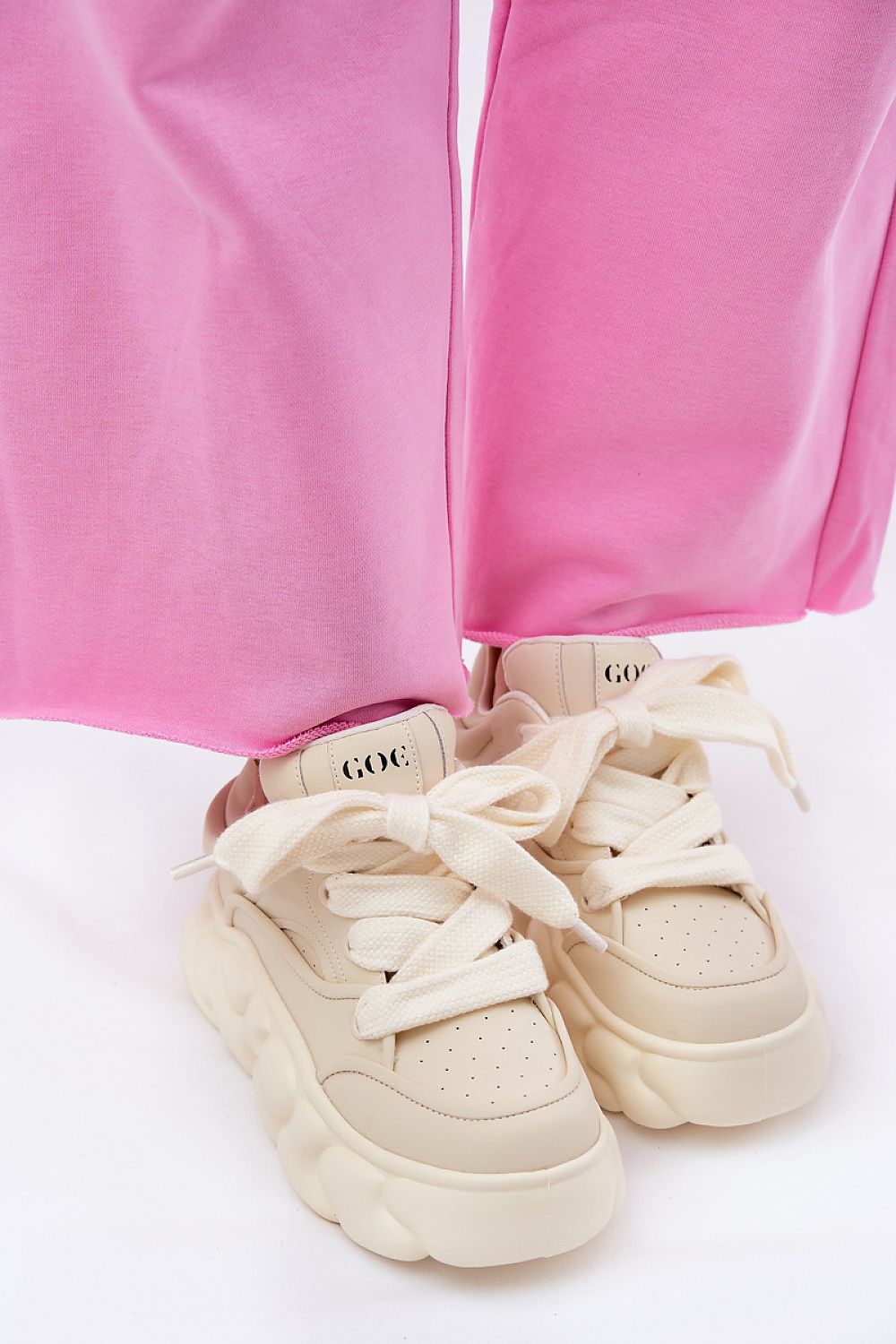 Vernesse Elevated Leather Sport Shoes with thick laces, featuring a bold platform design and pink pants for a stylish look.