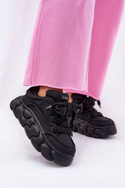 Black Vernesse Elevated Leather Sport Shoes with thick lacing and platform sole, paired with pink pants for a bold fashion look.