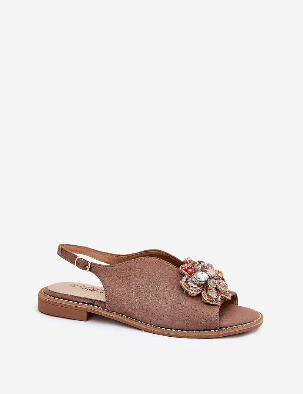 Fiorenna flat suede flower sandals with sculpted floral accent, cushioned insole, and adjustable ankle strap for all-day comfort.