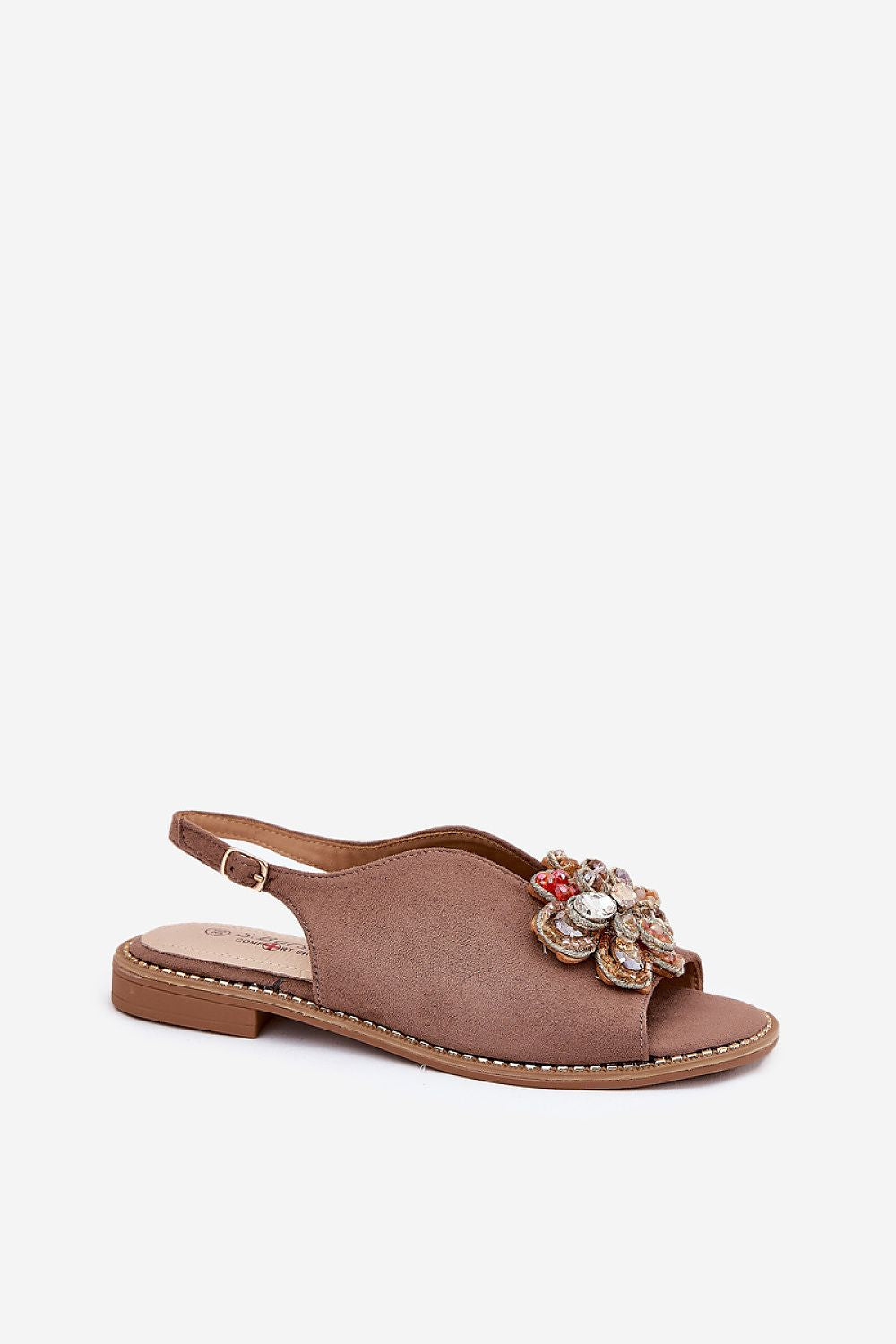 Fiorenna flat suede flower sandals with sculpted floral accent, cushioned insole, and adjustable ankle strap for all-day comfort.