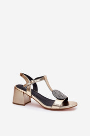 Evelenne leather sandals with sculpted column heel, featuring a modern front accent and adjustable ankle strap for elegant style and comfort.