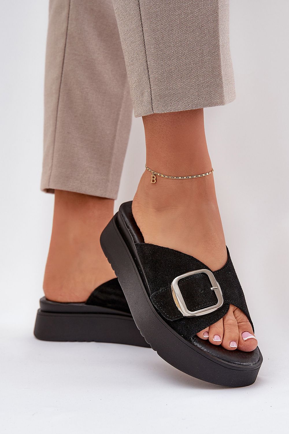 Chic Solva Suede Platform Slides with bold buckle and adjustable strap for comfortable, stylish, all-day wear.