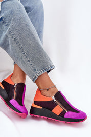 Woman wearing Averielle Wedge Zip Sport Shoes in vibrant colors, featuring dual zippers and a sculpted wedge sole for style and comfort.