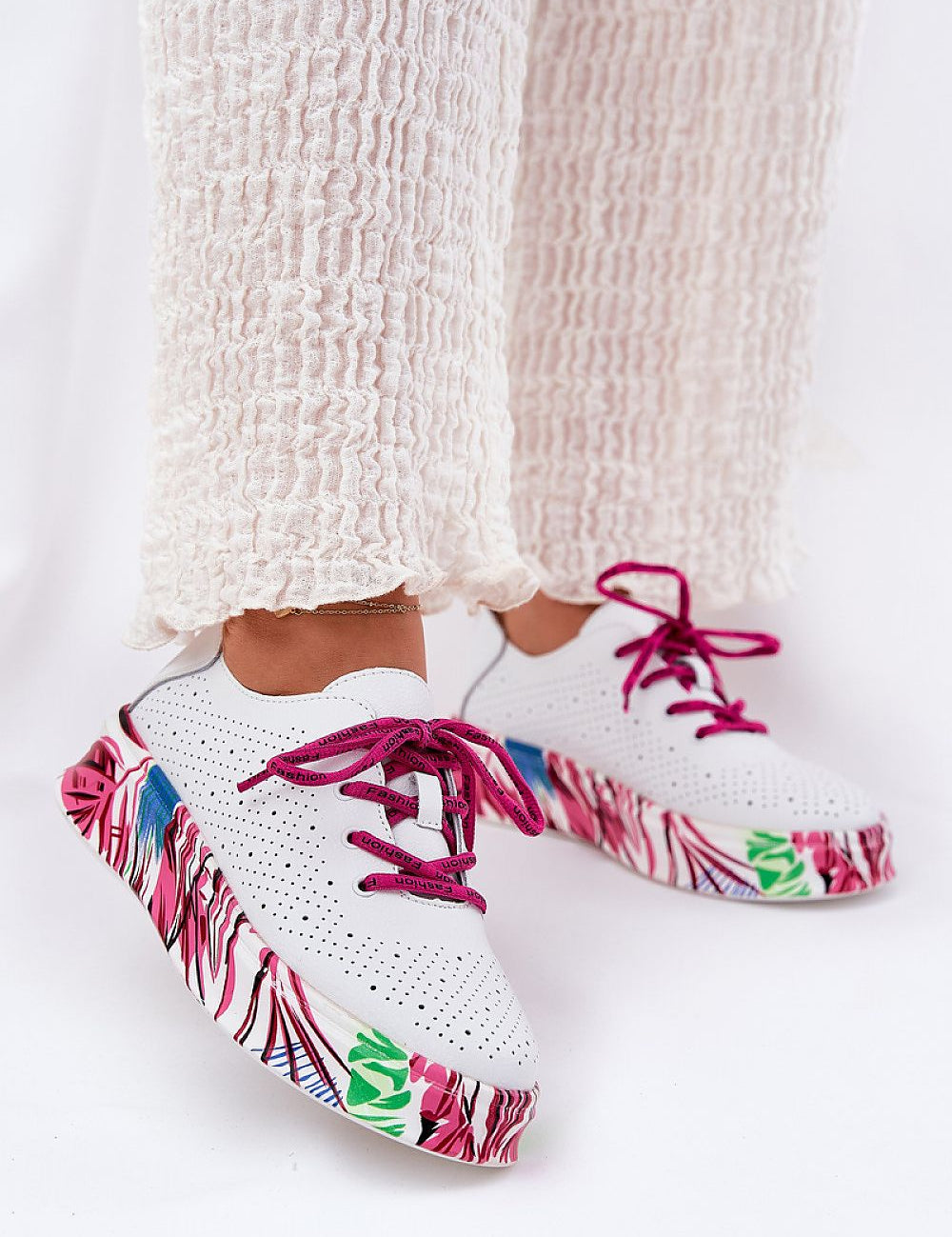 Lurevynn patterned platform sport shoes with leather upper and sculpted sole, featuring purple laces and colorful design details.