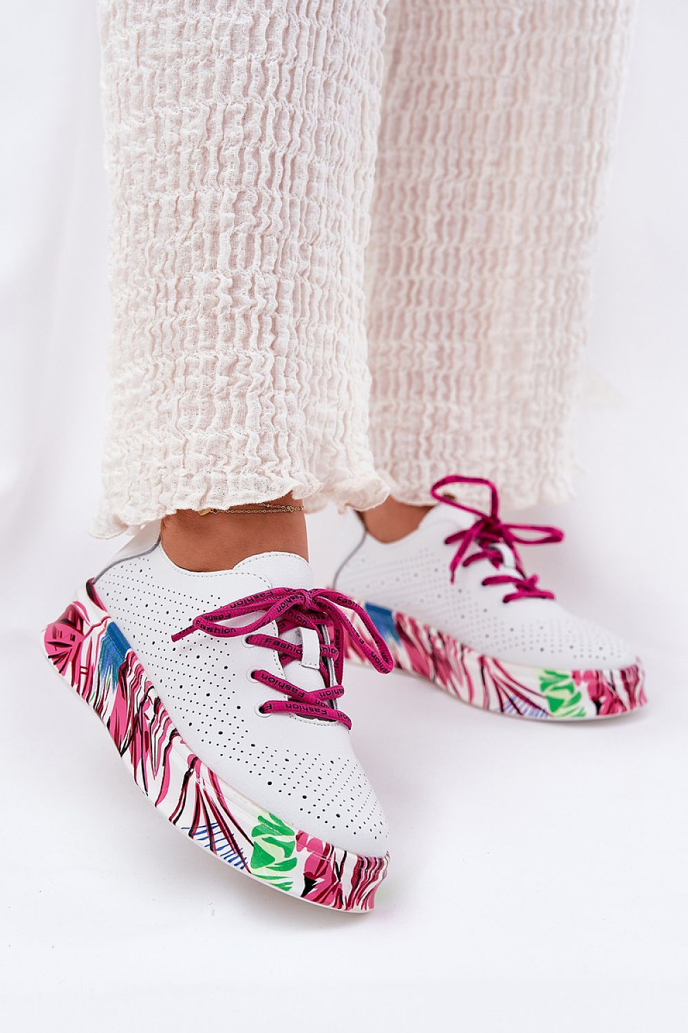 Lurevynn patterned platform sport shoes with leather upper and sculpted sole, featuring purple laces and colorful design details.