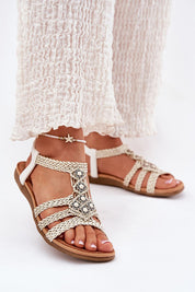 Ynessa braided flat summer sandals with faux leather straps, metallic accents, and a suede-like insole for comfort and style.