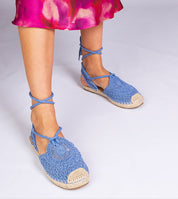 Blue Serella espadrille sandals on braided sole, perfect for summer; shown with colorful sundress.