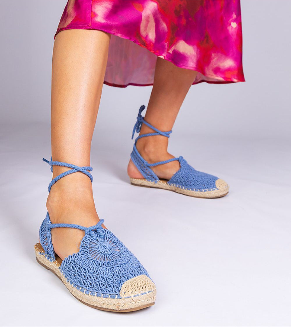 Blue Serella Espadrille Sandals with braided sole paired with a colorful summer dress, showcasing a relaxed and stylish look.