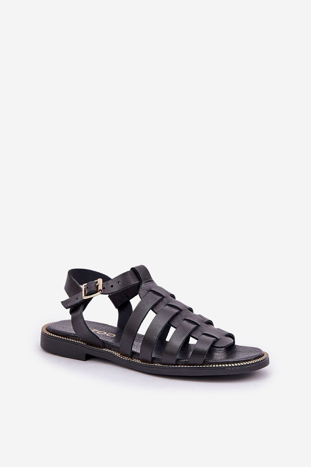 Black flat leather sandals with ankle buckle and woven straps, perfect for casual and elegant wear. Genuine leather; minimal design.