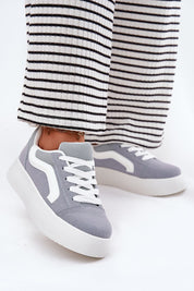 Ravelin Suede Platform Sneakers crafted from eco-suede with a rounded toe and supportive sole, styled with striped trousers.