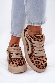 Leopard print platform sneakers with soft eco-suede, styled with light blue jeans, showcasing a chic casual footwear option.