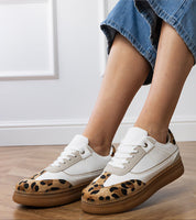 Women wearing Merisse Panther Accent Sneakers with panther print Details