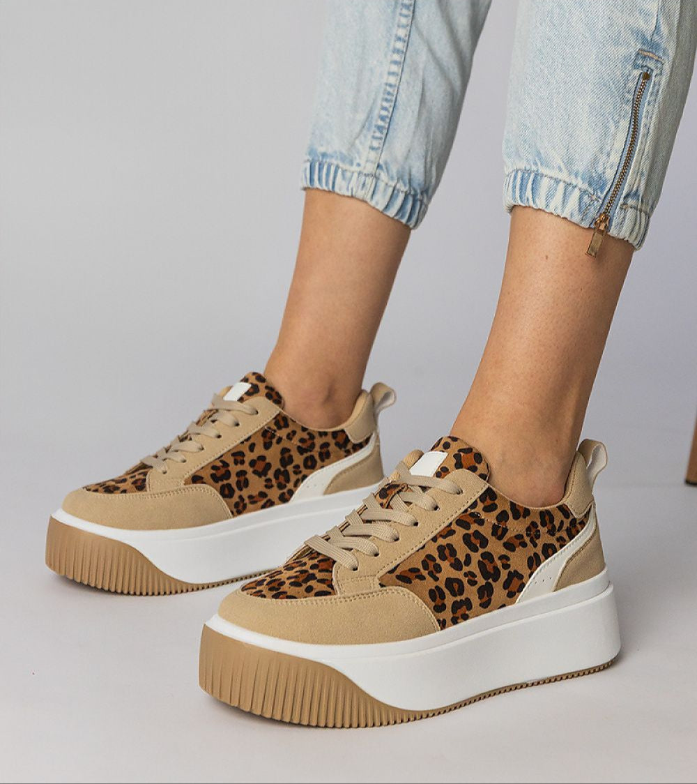 Voretta Panther platform sneakers with eco-suede and bold animal print, offering comfort and style with a sculptural sole.