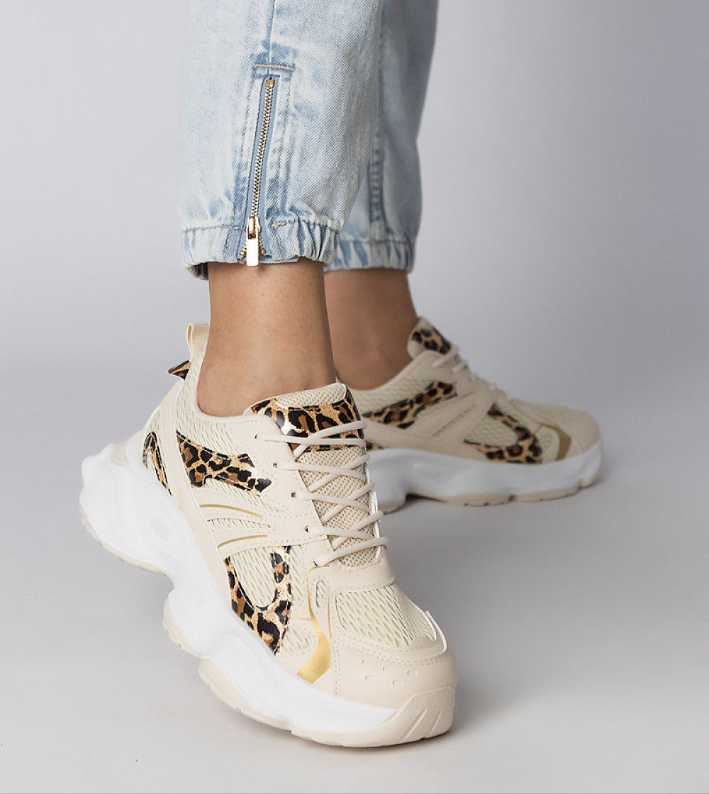 Thareen Platform Trainers with chunky sole and animal print detail, showcasing textured faux leather and urban style.