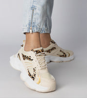 Thareen Platform Trainers with chunky sole and animal print detail, showcasing textured faux leather and urban style.