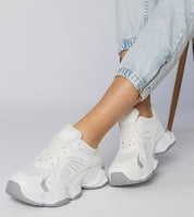 Person wearing Thareen Platform Trainers with a chunky sole and faux leather finish, capturing urban style and comfort.