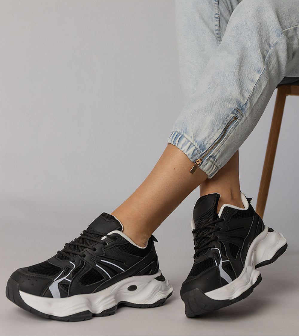 Black Thareen Platform Trainers with chunky 5 cm sole and textured faux leather, perfect for urban style and cushioned comfort.