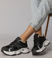 Black Thareen Platform Trainers with chunky 5 cm sole and textured faux leather, perfect for urban style and cushioned comfort.