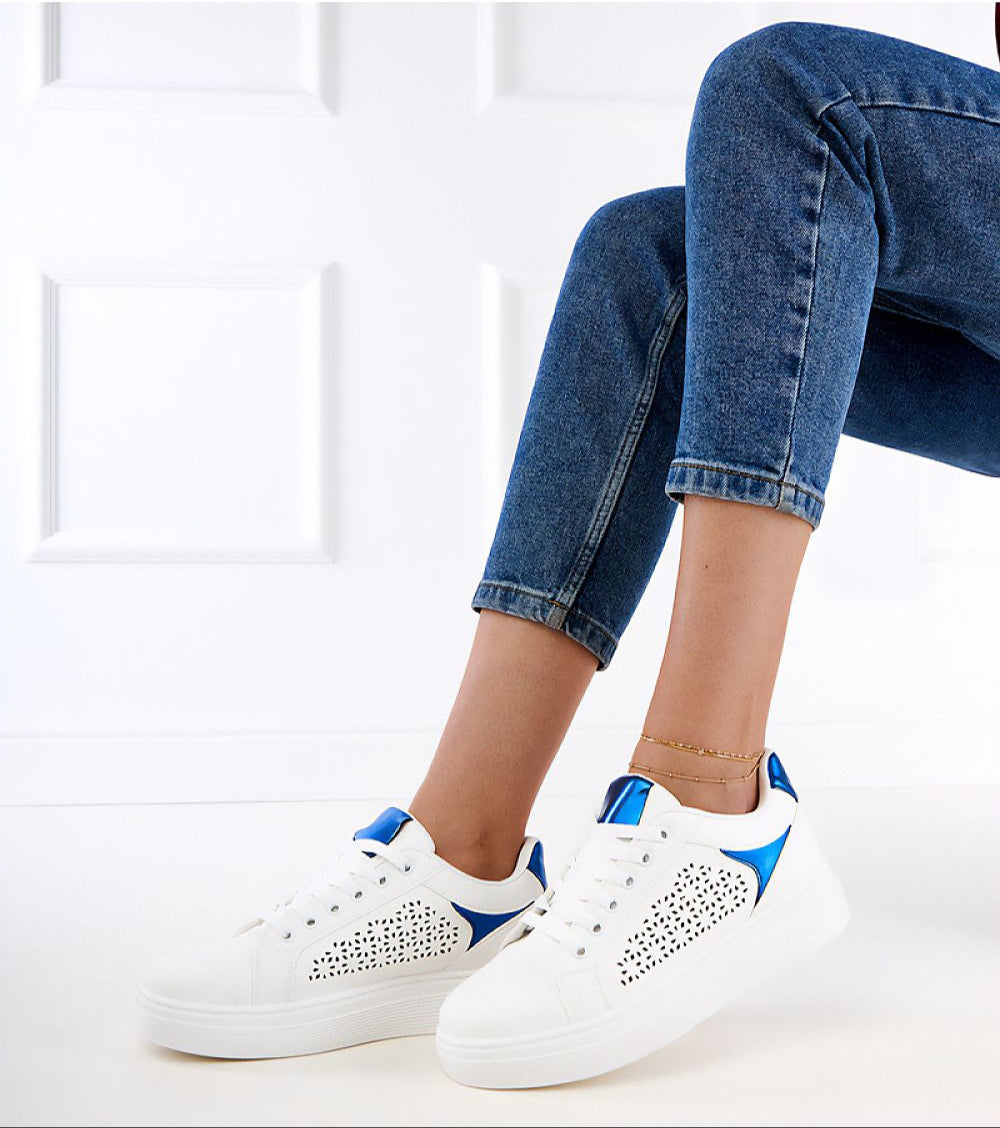Person wearing Alnora Urban Platform Sneakers with blue accents and elevated sole, showcasing urban style and comfort for city life.
